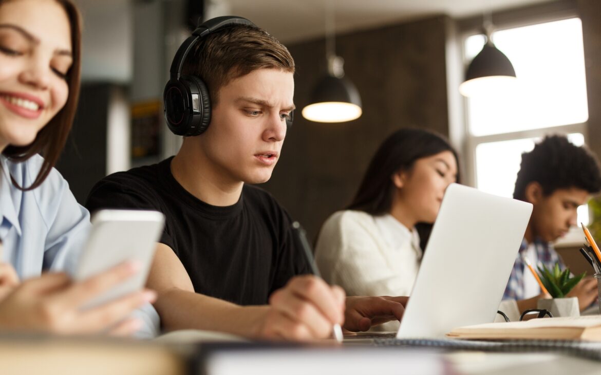 Group of students studying in university library