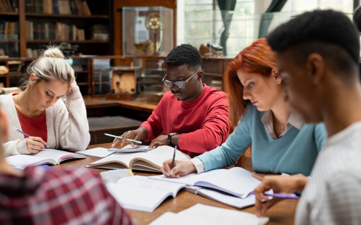 Group of university students studying together