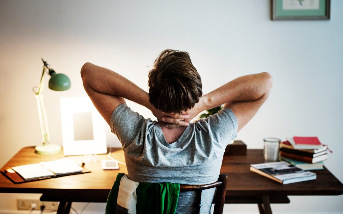 Man stressed while working on laptop