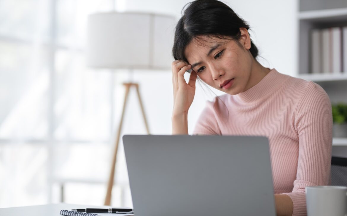 Young Woman Stressed at Work, Overwhelmed Female Professional, Office Stress, Workplace Anxiety